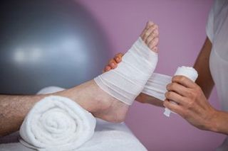 Neuromas — Nurse Putting Bandage On Foot in Orlando, FL Neuromas — Nurse Putting Bandage On Foot in Orlando, FL