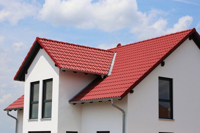 Roof Repairs — New Residential Home with Red Roof in Napa, CA