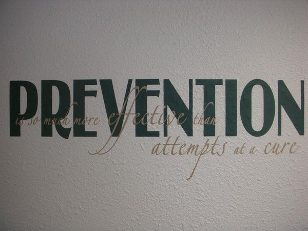 The word prevention is on a white wall