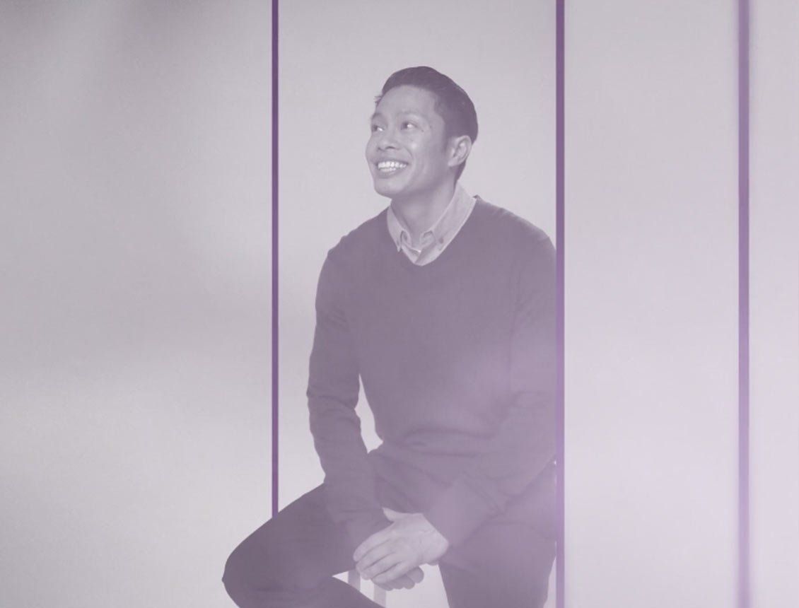Image of an employee film in a white studio with motion graphics Image of an employee film in a white studio with motion graphics