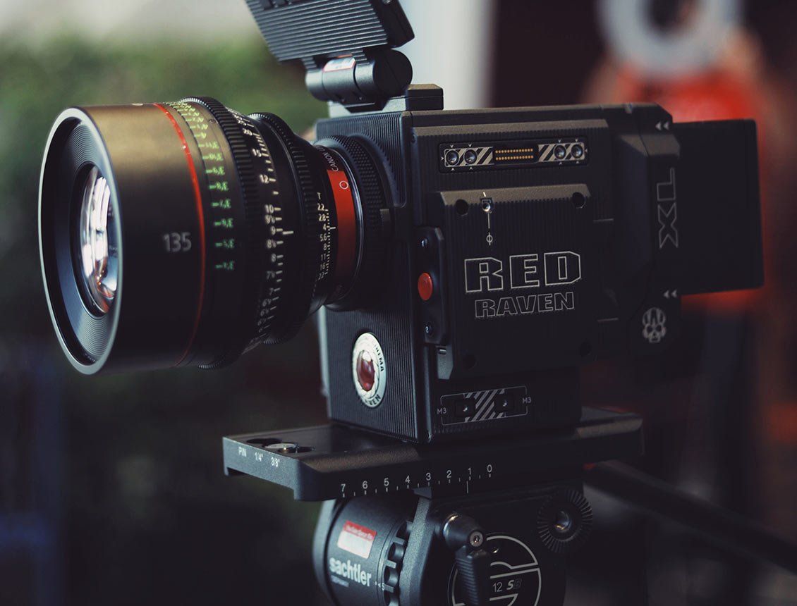 Close up image of RED cinema camera A red epic camera is sitting on a tripod