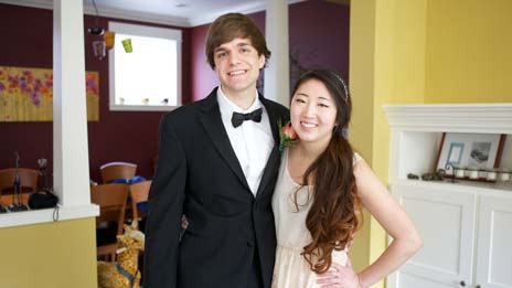 Spin Creative behind the scenes photo Treehouse brand video tv commerical shoot prom date A man in a tuxedo and a woman in a dress are posing for a picture.