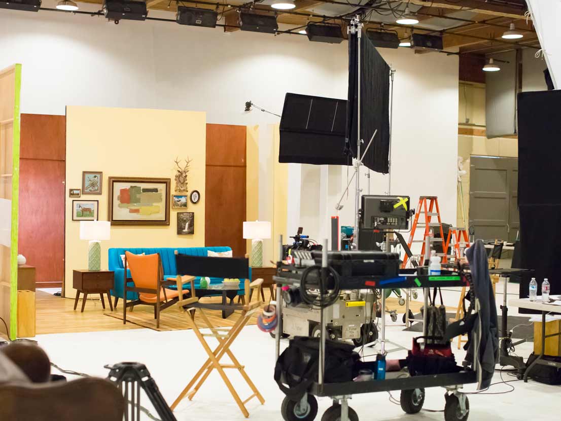 A director 's chair is in the middle of a living room