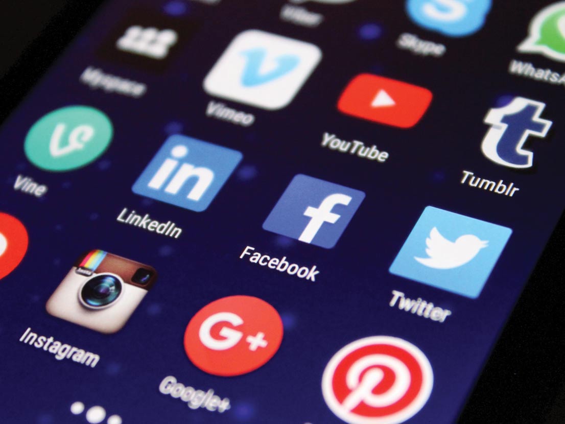 A close up of a cell phone screen with social media icons