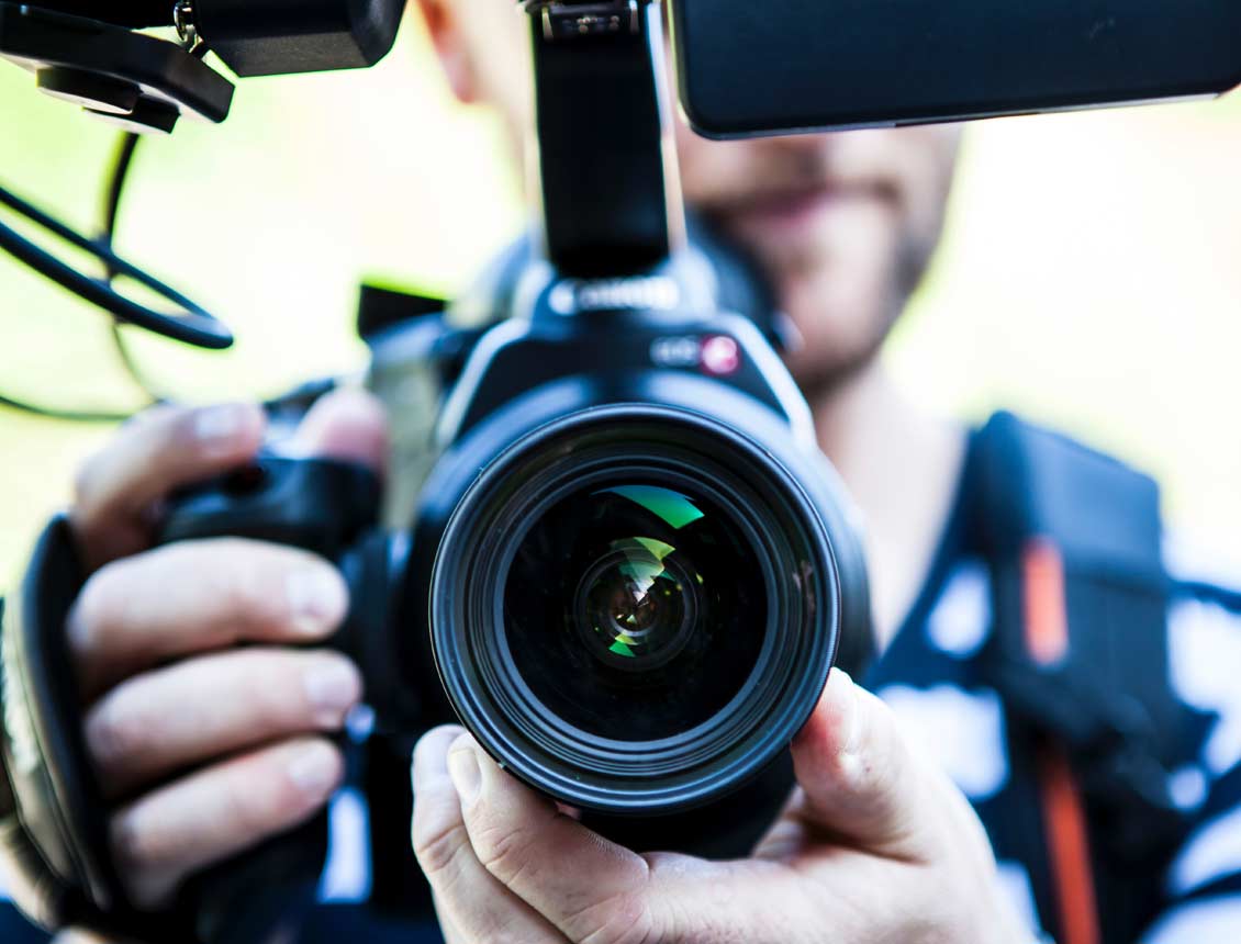 A man is taking a picture with a camera.
