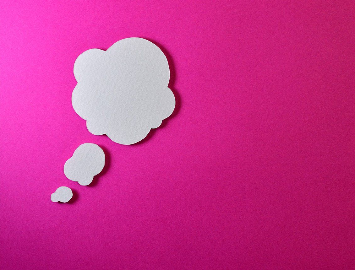 Image of a thought bubble over pink background A white thought bubble on a pink background.