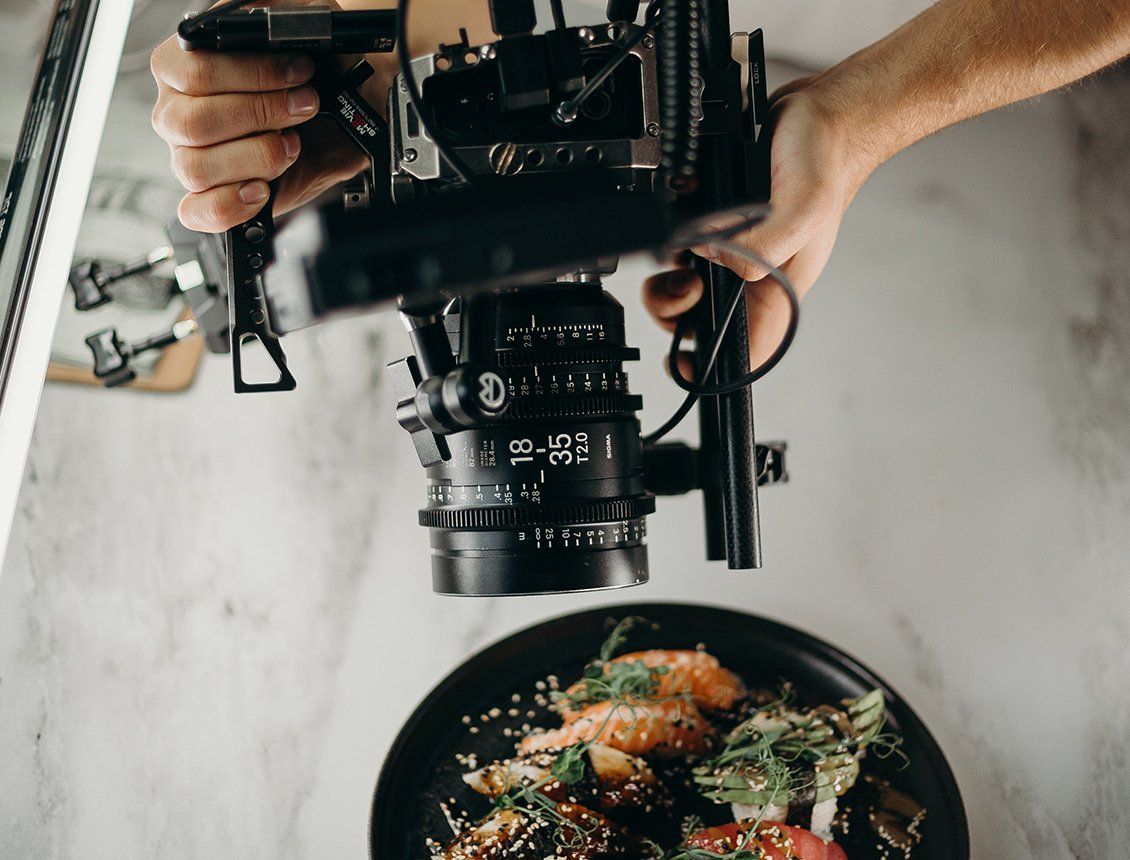 Image of cinema video camera filming a food dish Image of cinema video camera filming a food dish