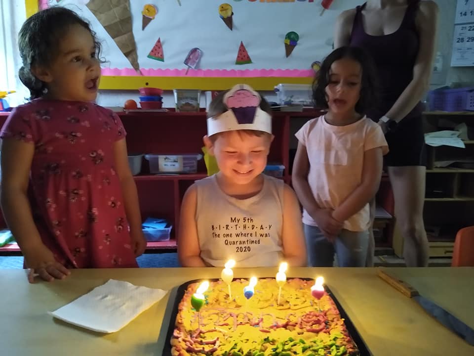 A Boy Blowing The Cake — St. Louis, MO — Sappington Child Care Center & Summer Day Camp