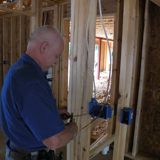 Electrician Cutting Electric Wire — Shawano, WI — Raddant Electric Service Inc