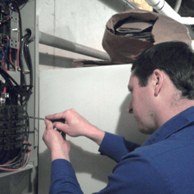 Electrician With Screwdriver — Shawano, WI — Raddant Electric Service Inc