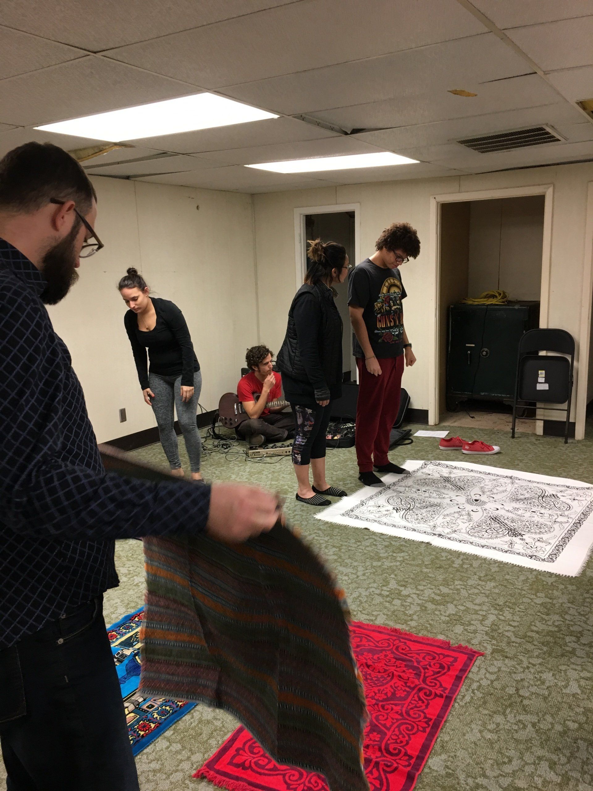 People Putting Mat On The Floor – Dallas, TX – Artstillery