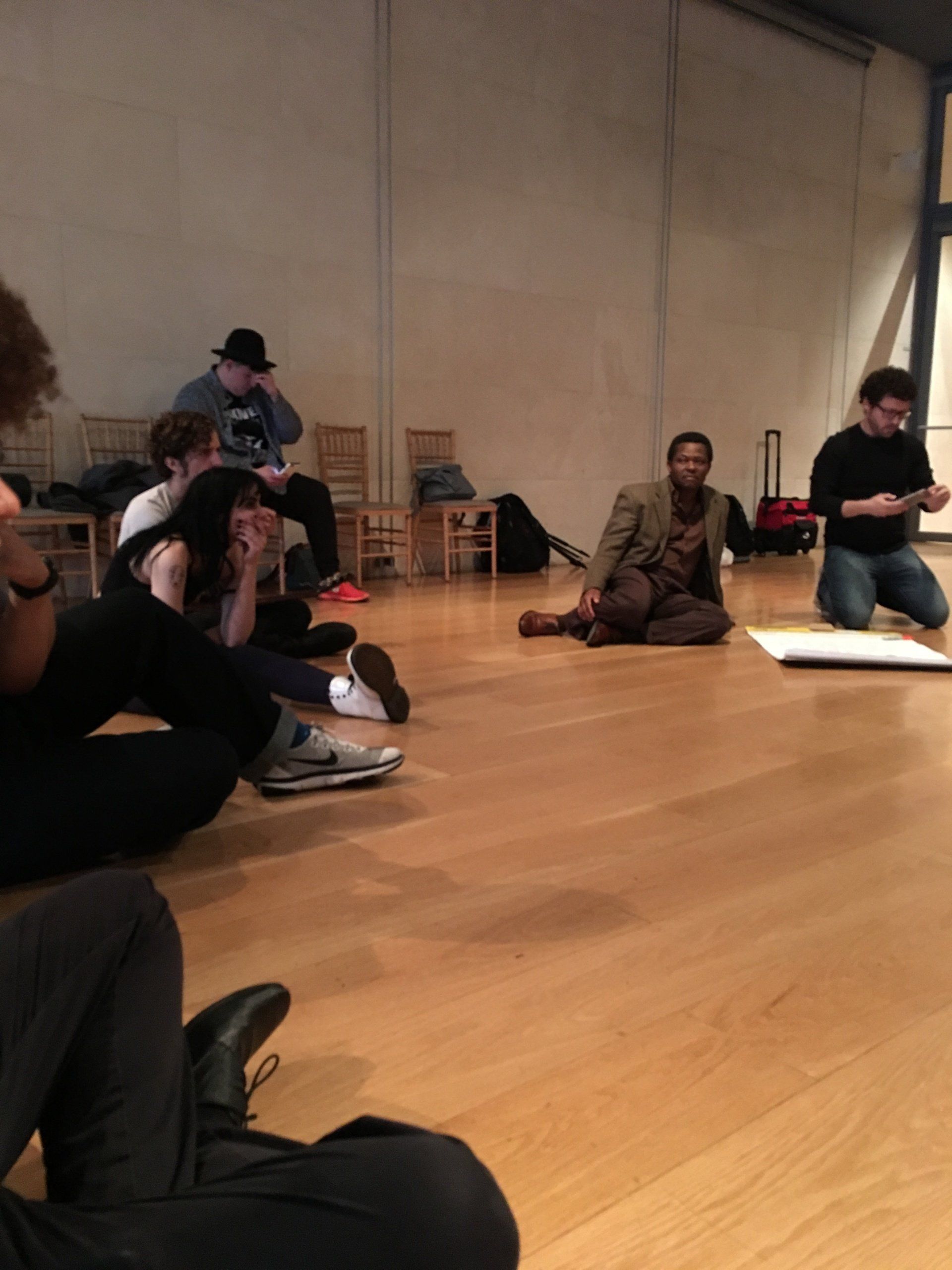People Sitting On he floor During The Mitiinnb– Dallas, TX – Artstillery
