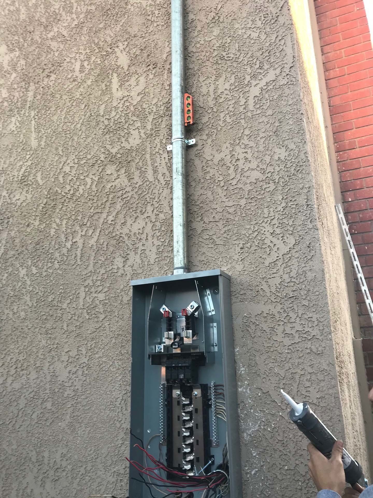 Man Fixing a Break Box — Riverside, CA — Volt Tech Electric