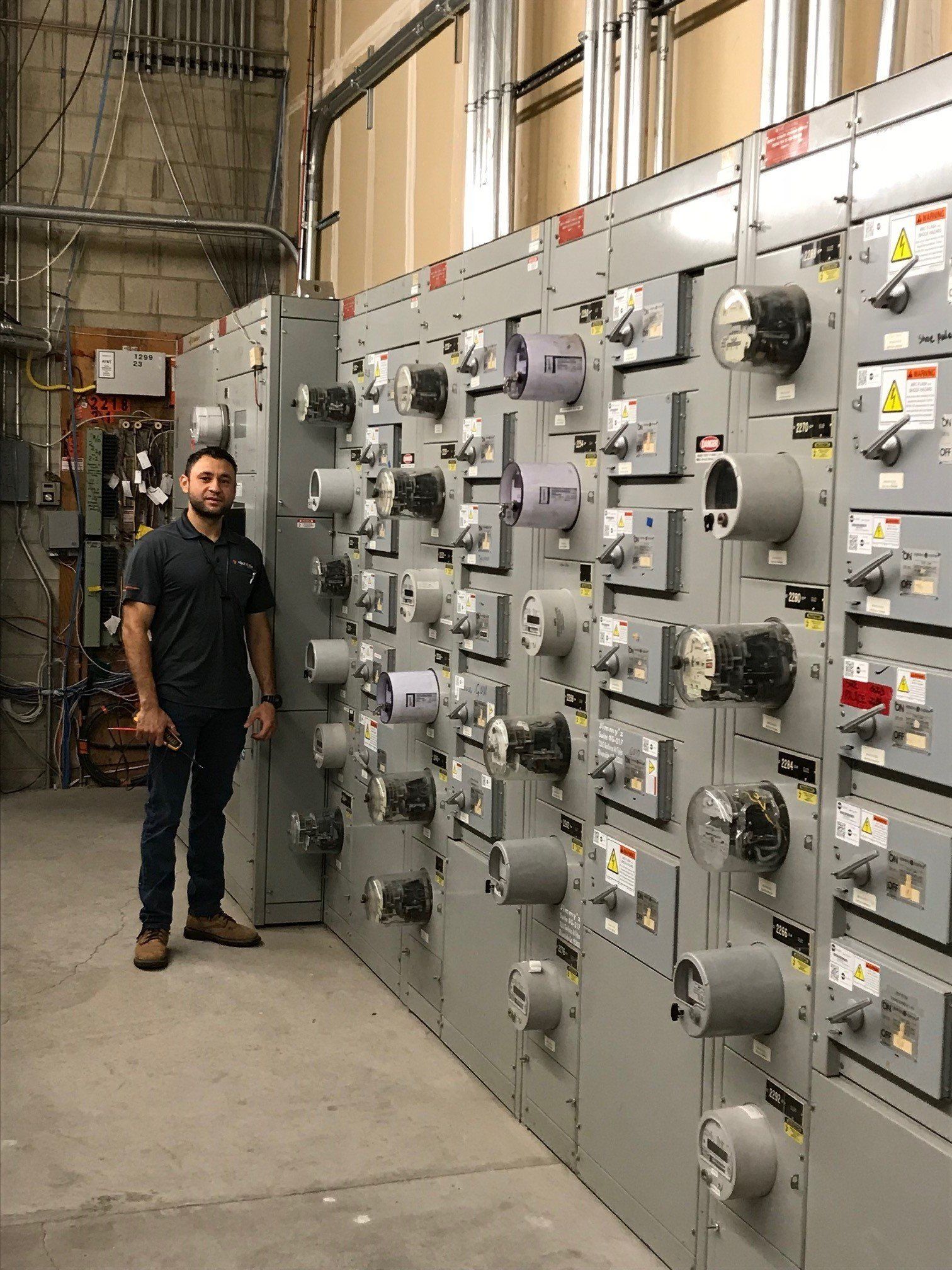 Man Beside Power Meter — Riverside, CA — Volt Tech Electric