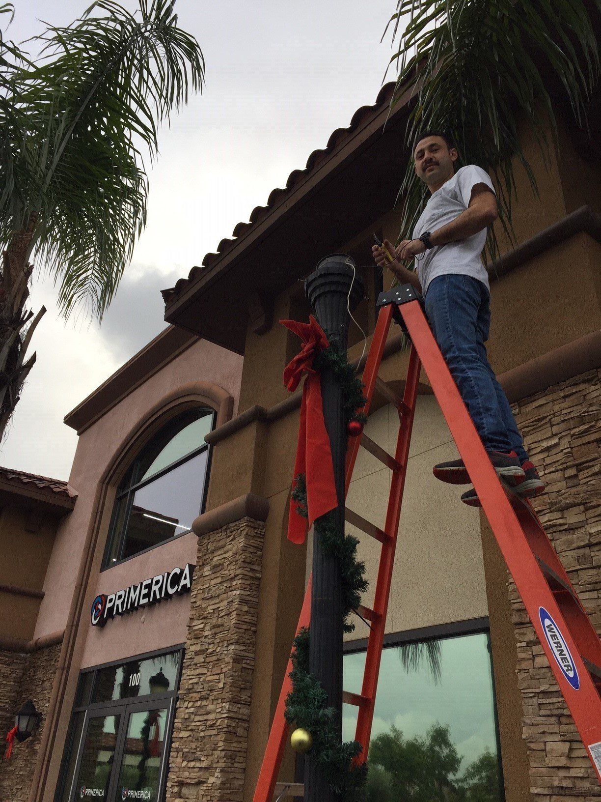 Man Repairing Light Post — Riverside, CA — Volt Tech Electric