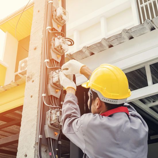 Electrical Repair — Electrician In A Gray Uniform in Riverside, CA Electrical Repair — Electrician In A Gray Uniform in Riverside, CA