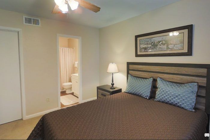 bedroom with door to bathroom