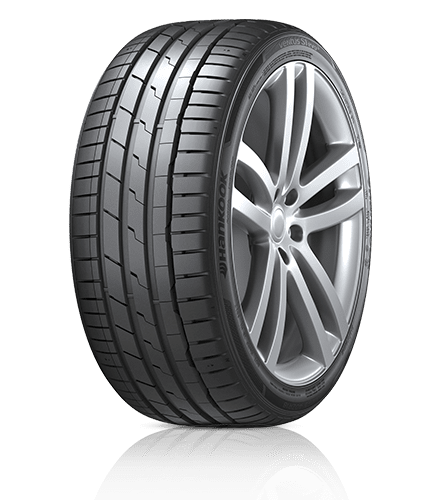 A close up of a car tire on a white background.