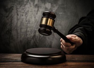 Attorney Holding a Gavel - Law Offices of Andrew J. Zaroulis in Lowell, MA