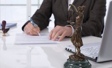 Lawyer Signing Contract- Law Offices of Andrew J. Zaroulis in Lowell, MA Lawyer Signing Contract- Law Offices of Andrew J. Zaroulis in Lowell, MA