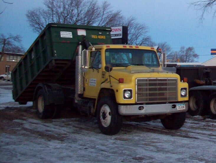 Garbage Can And Truck — Storm Lake, IA — Garbage Hauling Service Inc Garbage Can And Truck — Storm Lake, IA — Garbage Hauling Service Inc