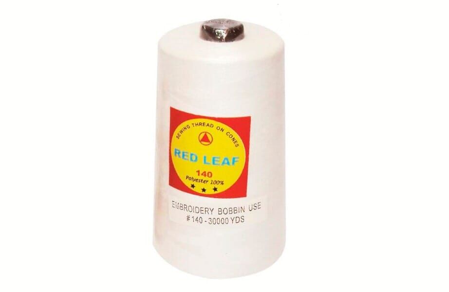 White cylindrical container with a red-and-yellow “Red Leaf” label and metal cap