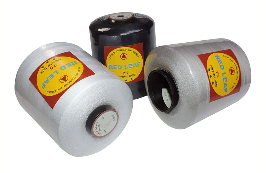 Three rolls of white, black, and silver tape with yellow labels on a white background