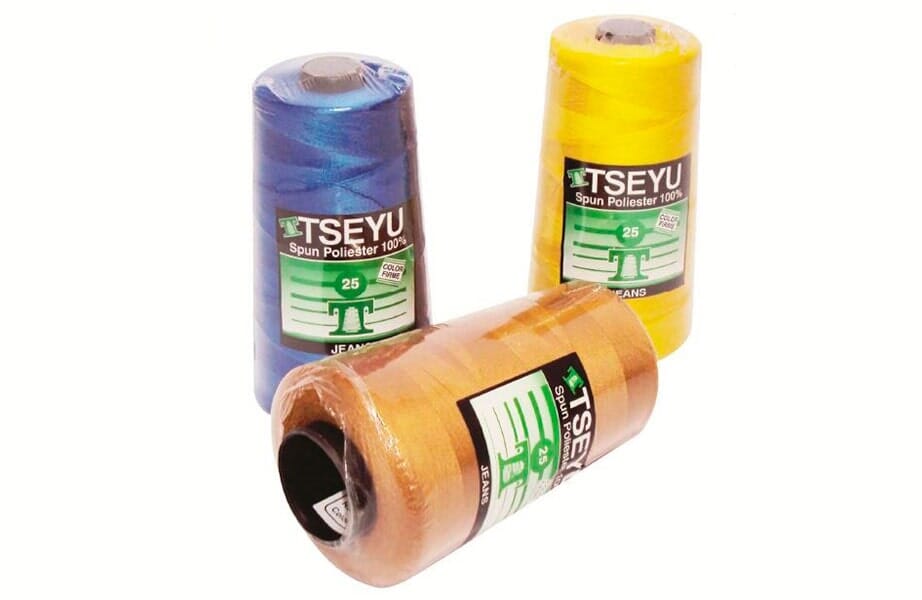Three rolls of colored thread spools with labels, arranged on a white background.