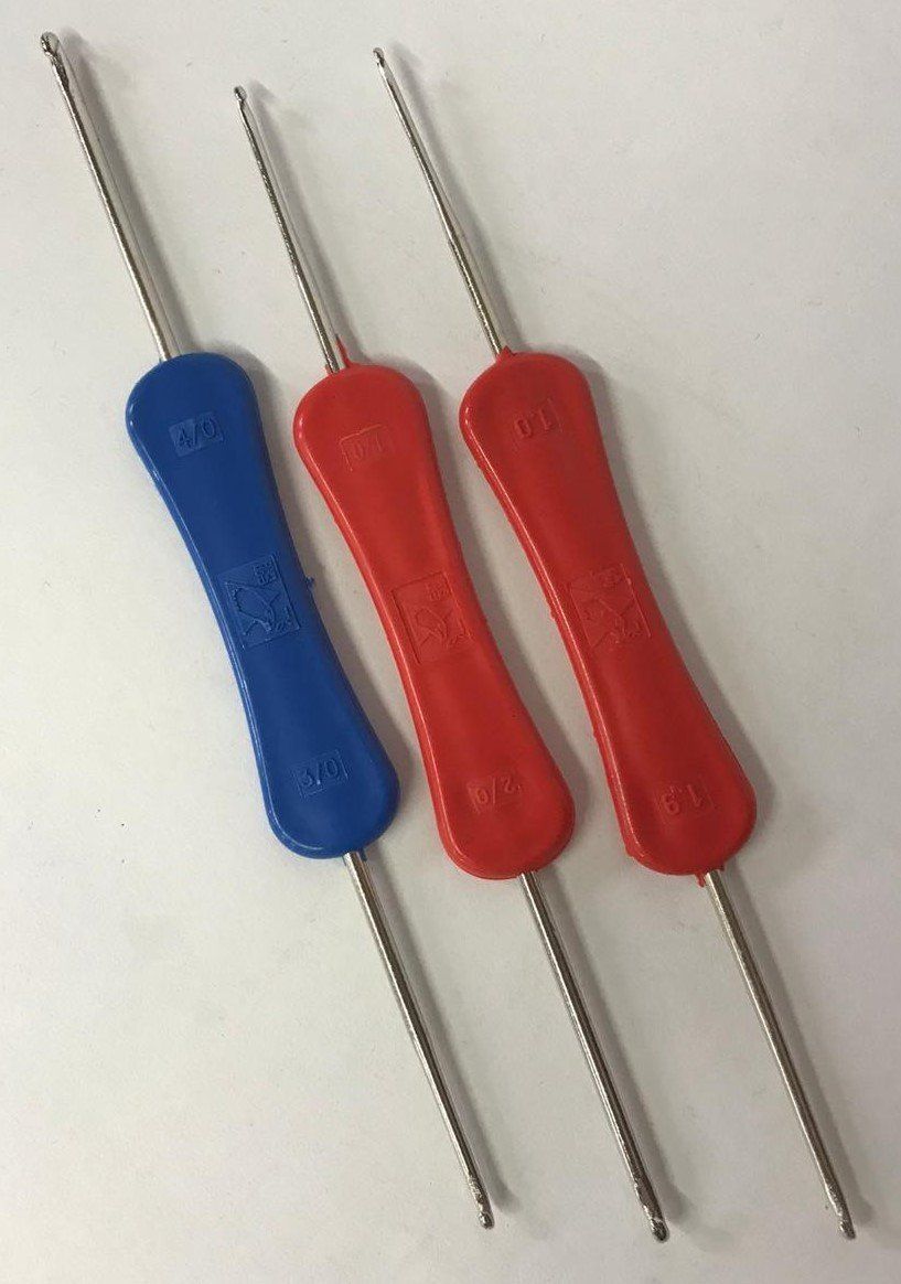 Three colorful pipe cleaners with blue, red, and red handles on a light background