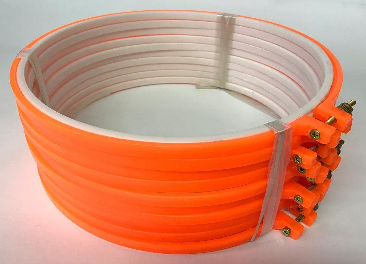 Orange coiled cable with white inner layers and small orange connectors on one end