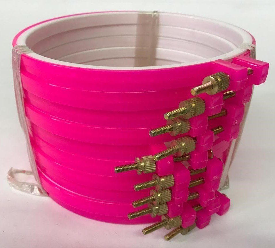 Pink plastic adjustable clamp band around a white container
