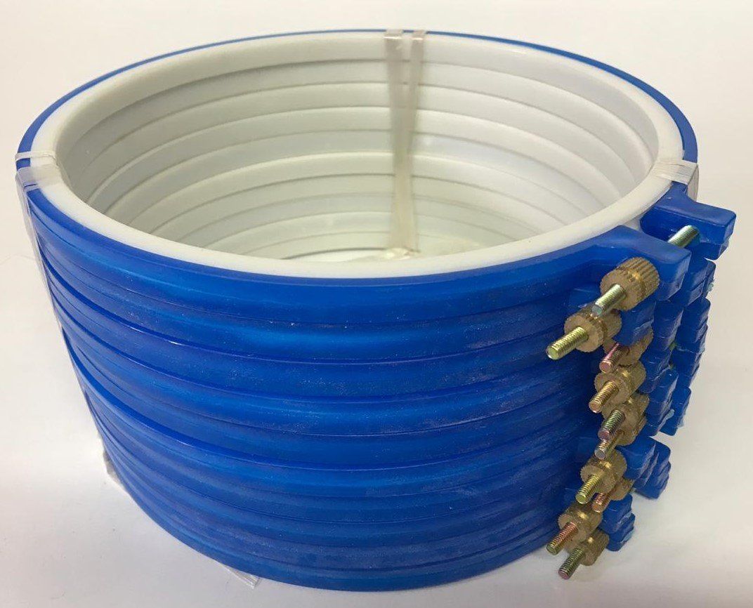Blue coiled hose with white interior and brass connectors on the side