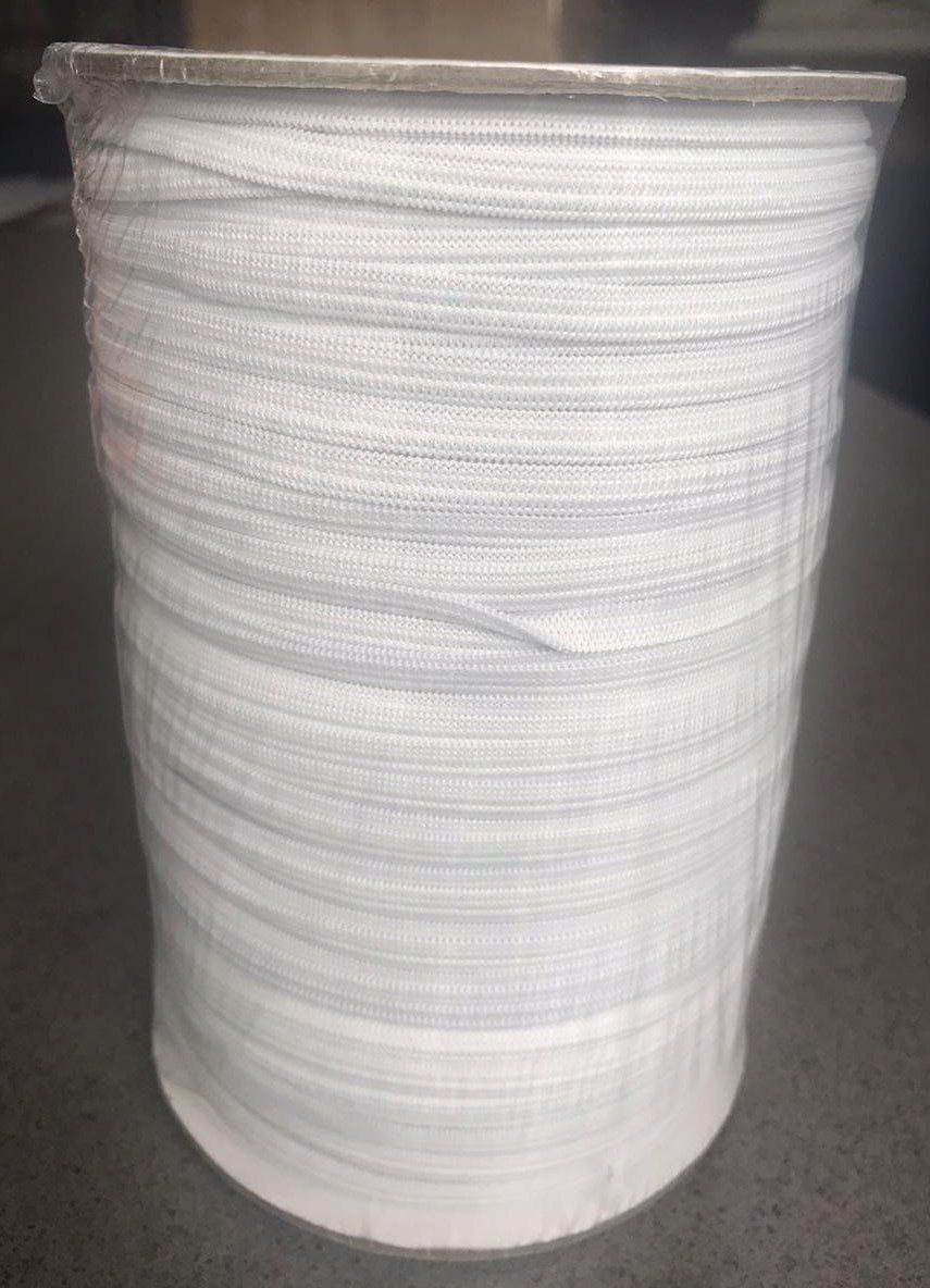 White woven cylindrical basket or container with a slightly flared rim on a plain surface