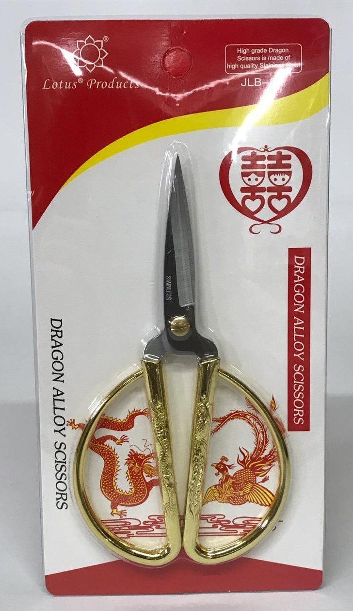 Decorative gold-handled scissors in red-and-white retail packaging