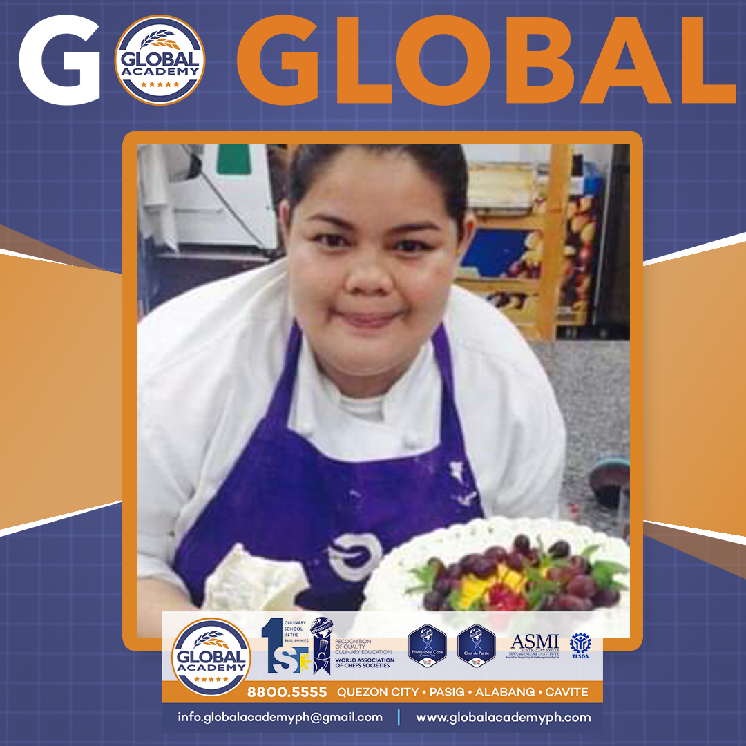 Chef in a purple apron smiling beside a decorated cake, with “GLOBAL” banner and logos above and below.