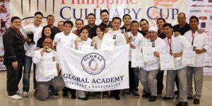Group holding certificates and banner at a company cup awards ceremony