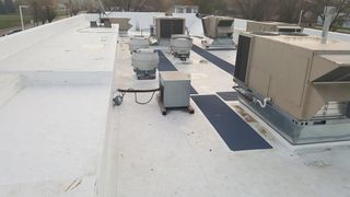 Tiler covering roof with new tile - Roofing Services in Sioux City, IA Tiler covering roof with new tile - Roofing Services in Sioux City, IA
