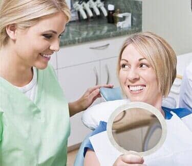 Dentist and patient — Dental Office in Virginia Beach, VA Dentist and patient — Dental Office in Virginia Beach, VA
