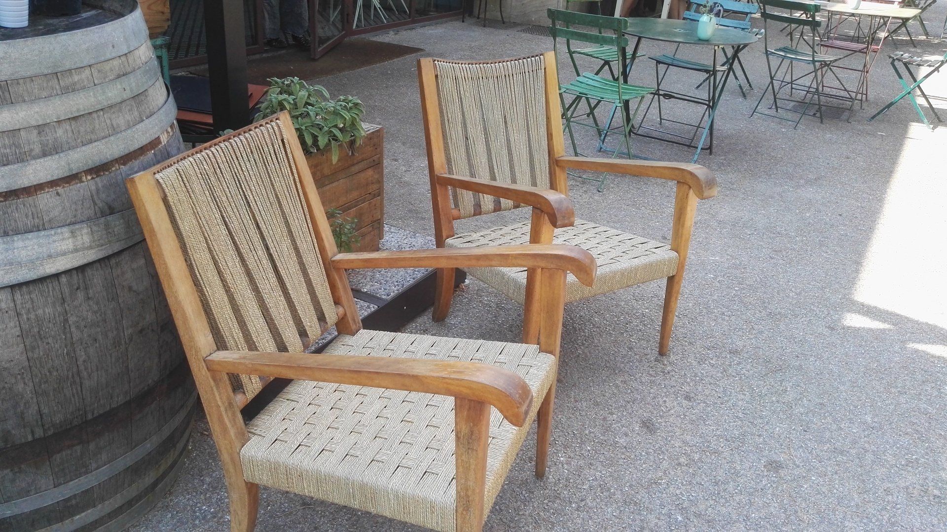 pair of chairs with woven seats and backs