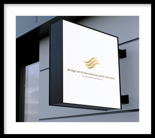 White hanging sign with gold logo on a modern building exterior