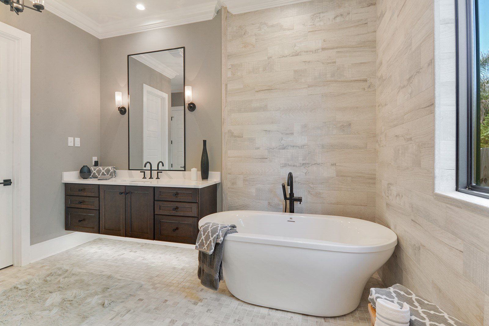 Bathroom with mirror and bathtub