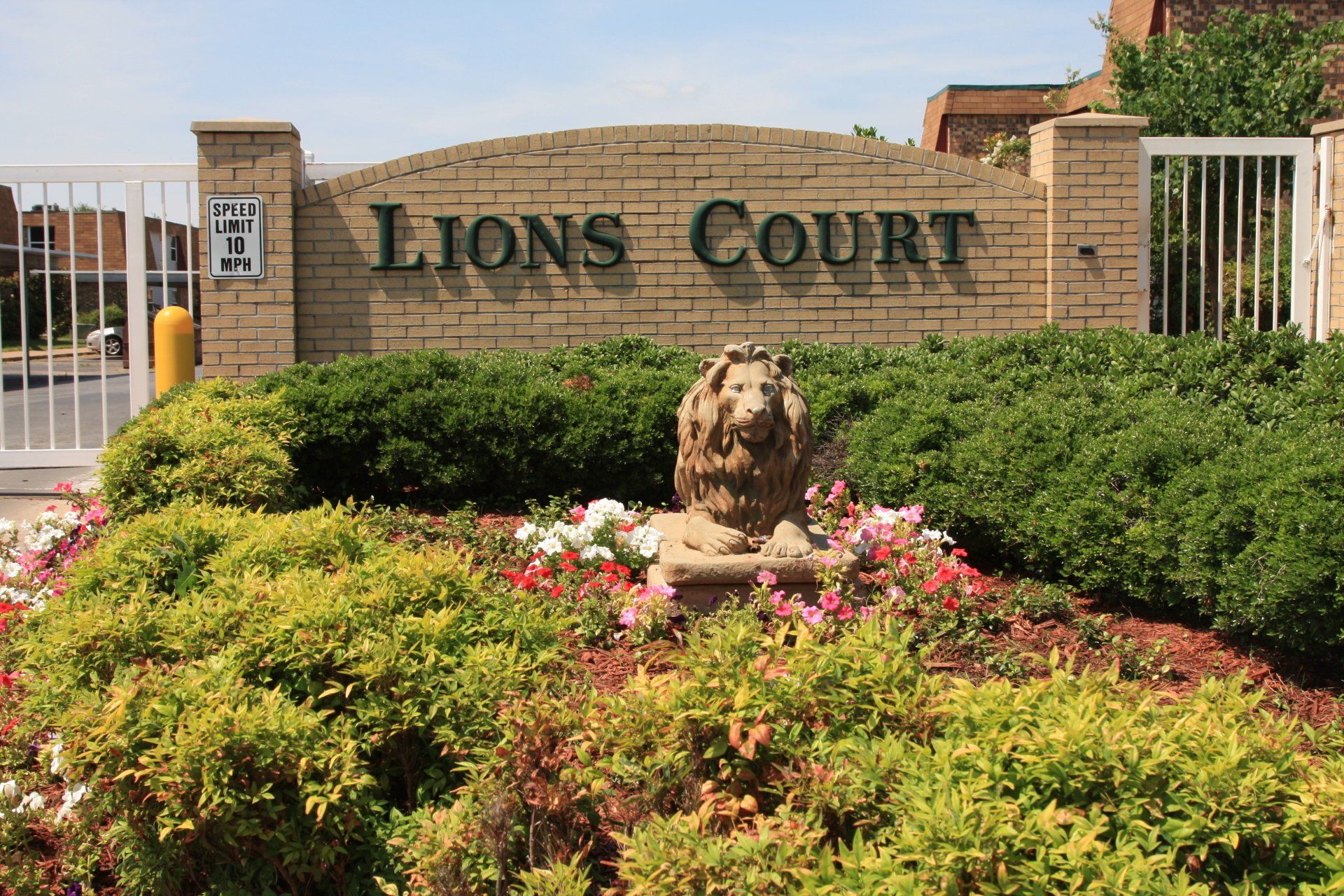Sign view at gated entrance of Lions Court Apartments in Wichita Falls TX