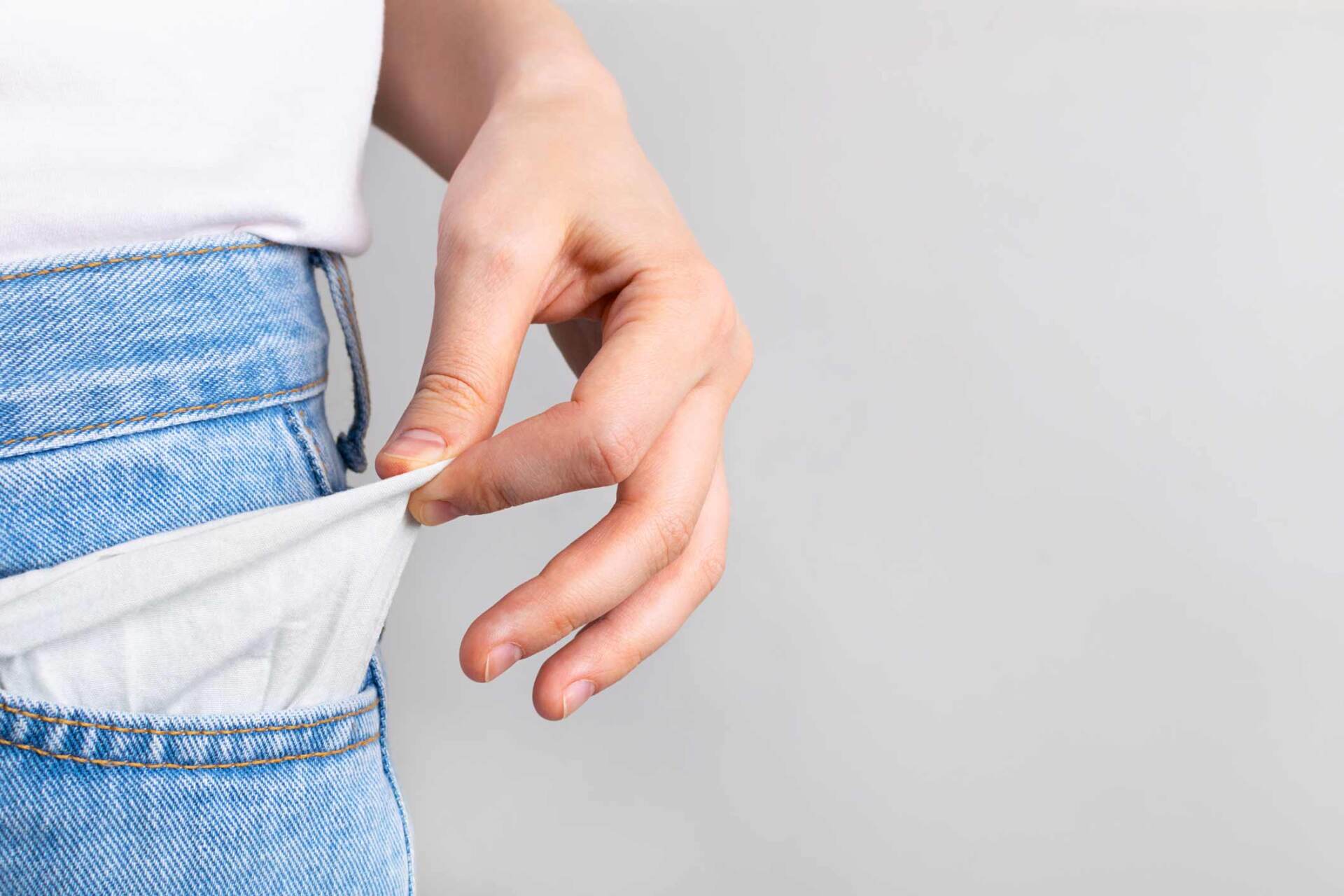 Woman Showing Empty Pockets With No Money — Royal Oak, MI — Melder & Melder, P.C.