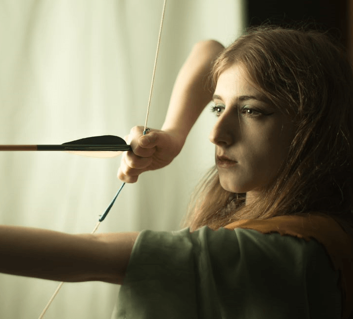A woman shooting a bow, representing Artemis.