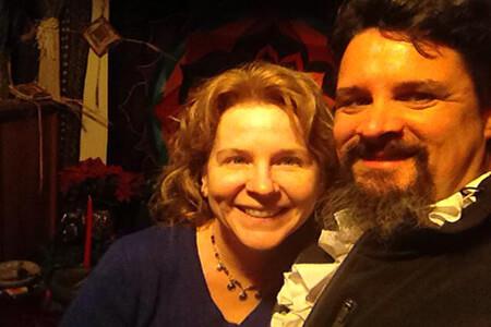 A man and a woman are posing for a picture together,  members of the Aquarian Tabernacle Church.