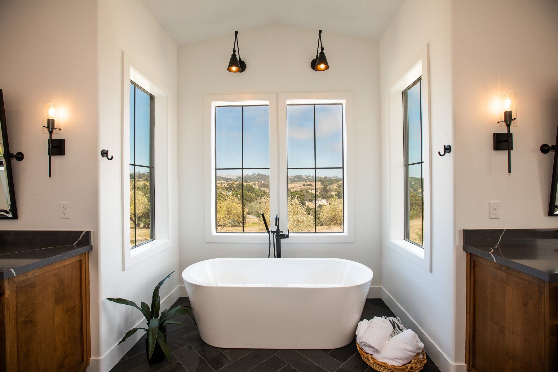 There is a bathtub in the middle of the bathroom.