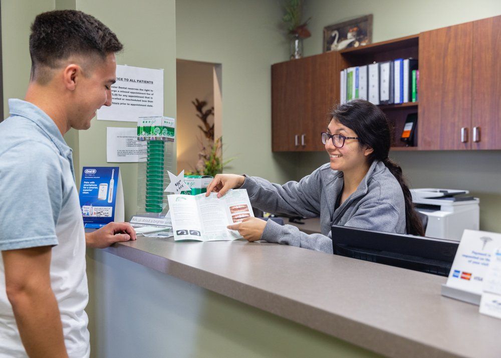 Ozone Treatment for Teeth — Front Desk and Patient in Jasper, IN