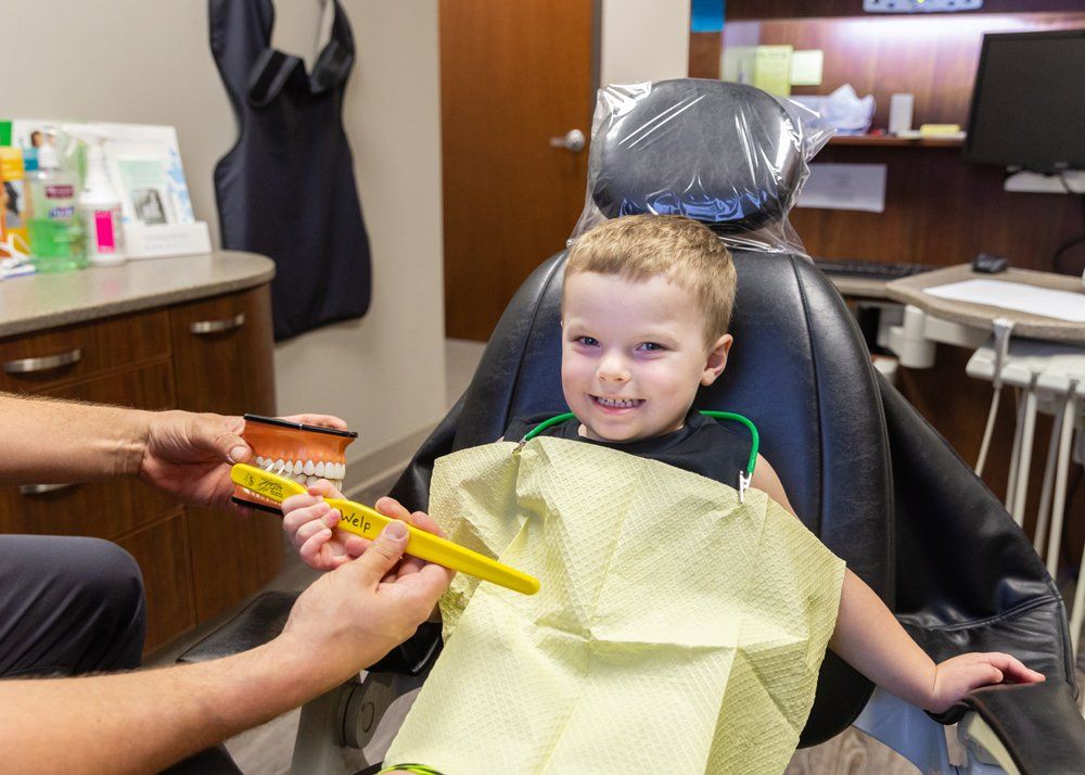 Kid Dentist — Kid in Dentist Chair in Jasper, IN Kid Dentist — Kid in Dentist Chair in Jasper, IN