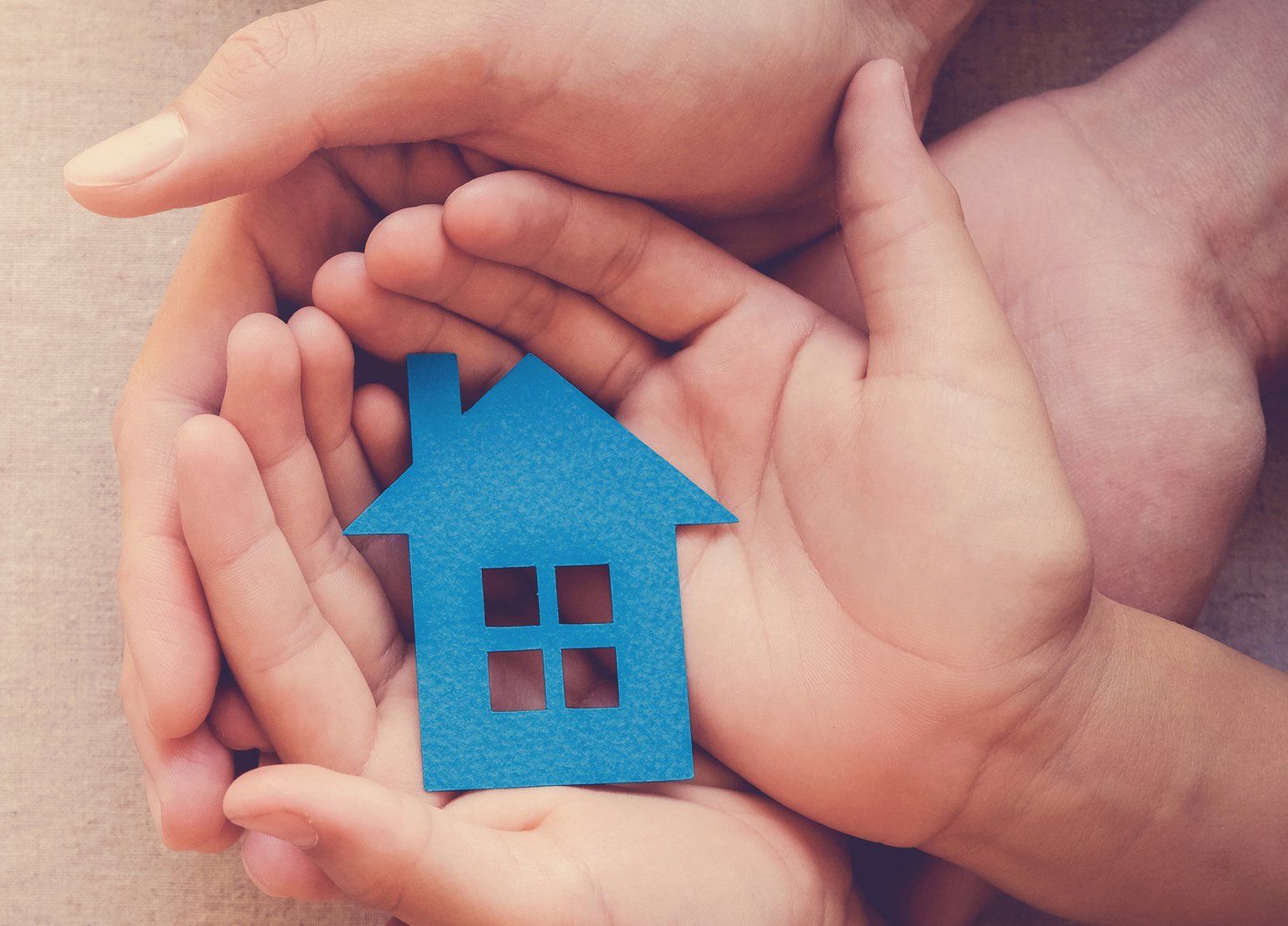 Adult and Child Hands Holding Paper House — Springfield, MO — Housing Authority of Springfield Adult and Child Hands Holding Paper House — Springfield, MO — Housing Authority of Springfield