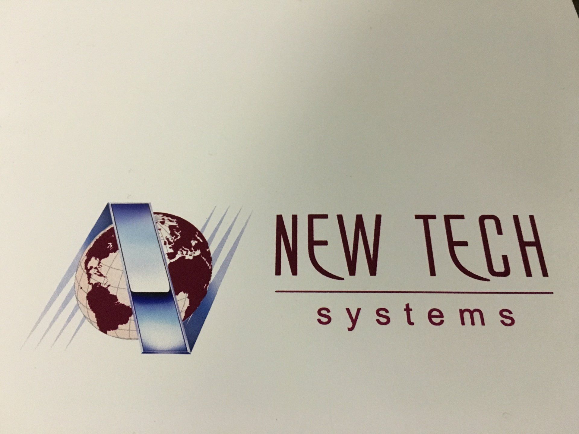 A logo for new tech systems with a globe on it